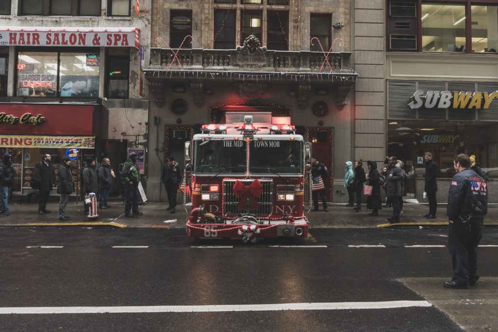 A fire truck is parked on the side of the street.