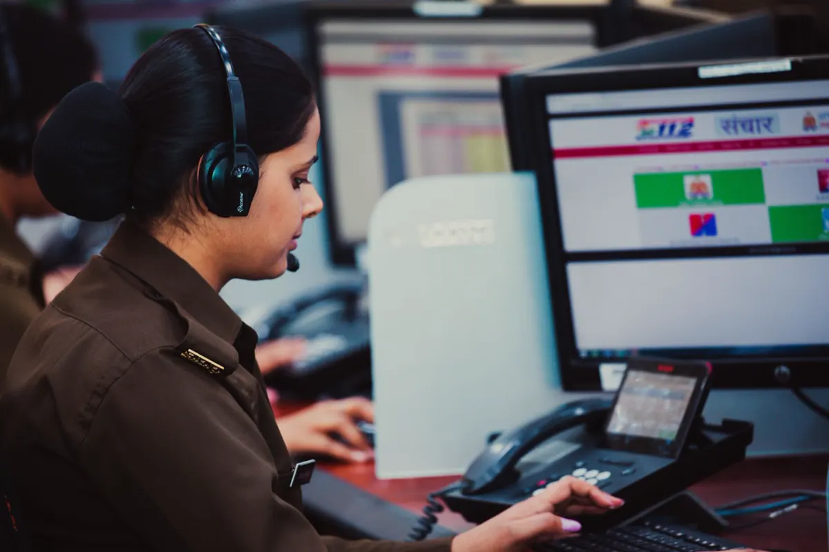 Dispatcher working at a console with call screens