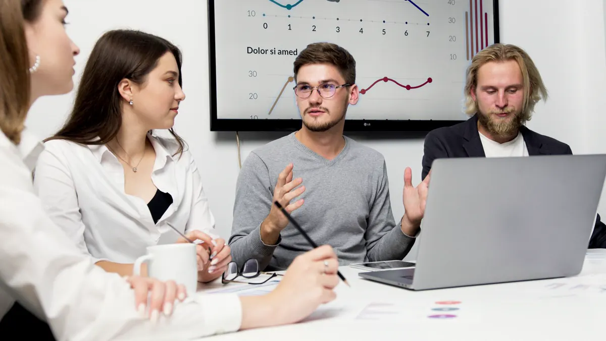 Small team discussing ideas around a table
