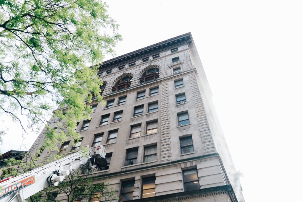 A tall building with a clock on the side of it.